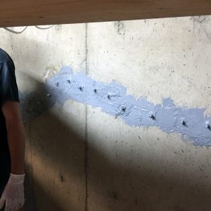 basement wall crack in foundation fixed with Urethane Injection